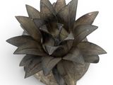 an image of a metal flower on a white surface