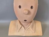 a clay head of a man with a number 35 on it