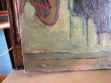 a picture of a painting on a shelf in a room