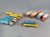 several toy trucks are lined up in a circle on a gray surface
