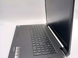 a laptop that is sitting on a white table