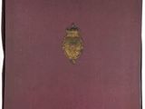 a red book with a gold emblem on the cover