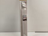 a close up of a metal door handle on a white surface