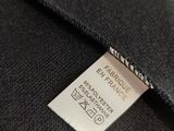 a close up of a label on a black jacket