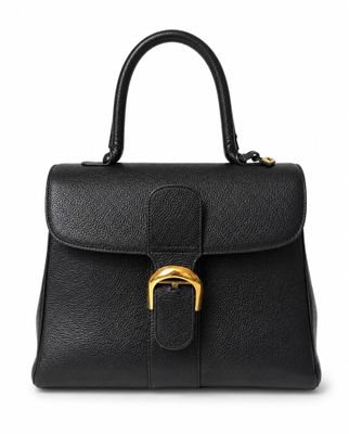 a black leather handbag with a gold buckle