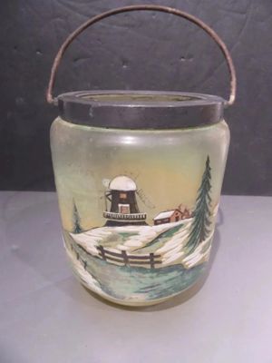 a glass jar with a picture of a boat on it