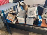 many boxes of electronic equipment sitting on a table