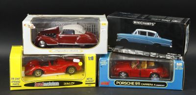three toy cars in the boxes on the table