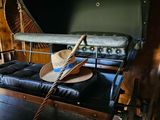 a suitcase with a hat on top of it in a room