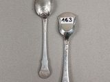 two spoons and a spoon with a number on them