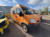 an orange van parked next to a yellow car in a parking lot