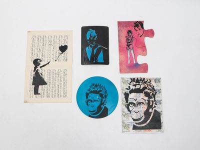 several pieces of artwork are displayed on a white surface