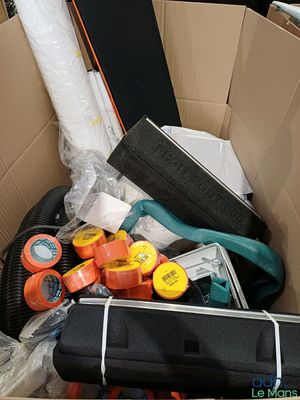a cardboard box filled with assorted items in it