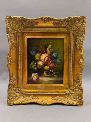 tableau représentant une nature morte composée de fleurs et de fruits, dans un cadre doré