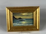 an oil painting of a sunset over the ocean in a gold frame