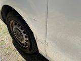 a white van that is parked on the side of the road
