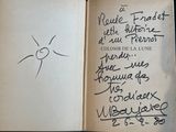 an open book with writing on it sitting on top of a table
