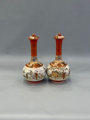 pair of chinese vases on a grey background