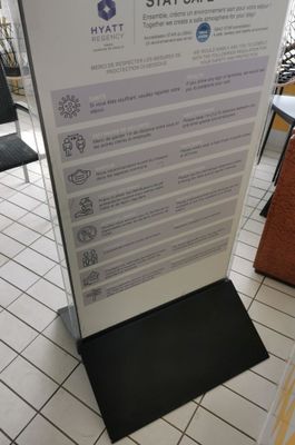 a sign in the middle of the floor that says stay safe