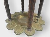a small table with three candles on top of it