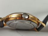 an image of a close up of a watch on a table