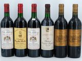 six bottles of wine are lined up in a row on a white surface