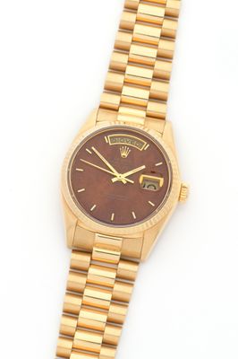 rolex a lady ' s 18ct gold automatic calendar wristwatch