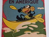 un gros plan sur un livre posé sur une table, avec un singe dans un bateau
