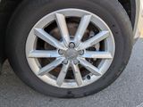 a close up of a tire on a car ' s rim