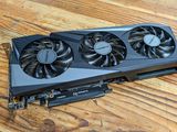 a close up of a video card sitting on top of a wooden table