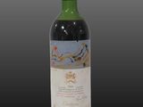 a close up of a bottle of wine on a black background