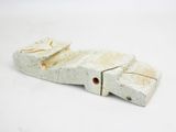 a small piece of pottery that is on a white surface