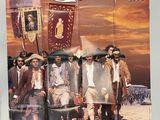 an old movie poster of a group of men standing next to each other