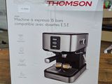 boxed box of a coffee machine sitting on top of a wooden table