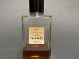 chanel eau toilette no 5 perfume bottle on a grey background