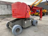 a red crane that is parked in a parking lot