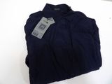 a close up of a blue shirt with a tag on it