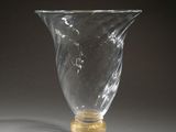 a glass vase that is sitting on a table