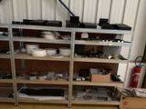 a shelf with many different items on it in a room
