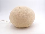 a white ball that is sitting on a white surface