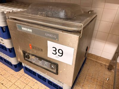 a machine that is sitting on top of crates in a kitchen