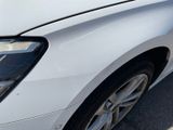 a close up of a car ' s headlight and the front end of it