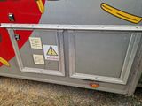 graffiti on the side of a bus with a bunch of stickers on it