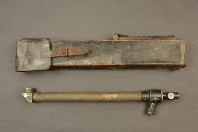 two old tools sitting on top of a table next to each other