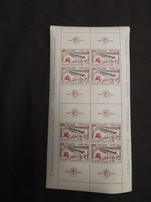 the stamps are on a piece of paper on a black surface