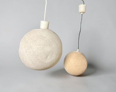 two balls that are sitting next to each other on a table