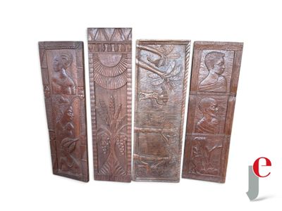 four pieces of carved wood with a bird and a bird on it