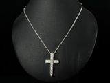 a necklace with a cross pendant on a mannequin mannequin