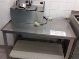 a kitchen with a stove, sink, and oven in it