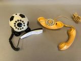 two phones that are sitting next to each other on a table